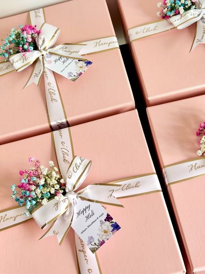 A little color and a lot of love for Holi. These return favor boxes are filled with festive essentials, including herbal gulaal, Ferrero Rocher chocolates, Shahi Thandai powder, and balloons to ensure a fun and safe celebration.