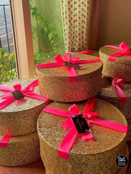 For a client who wanted extra glam, I created these gold glitter baby shower favor boxes with bright neon pink ribbons. They are perfect for making a statement.