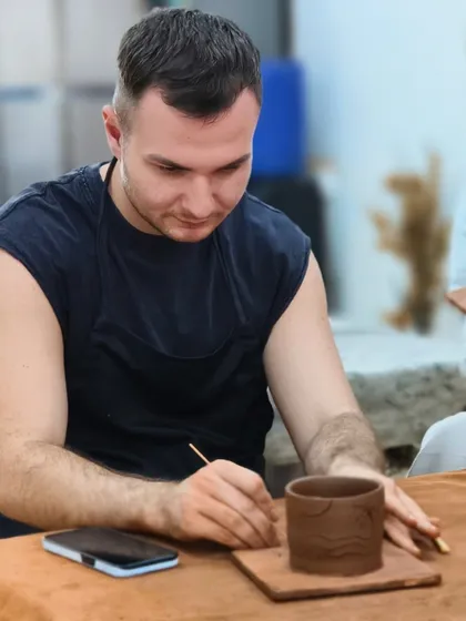 We are proud to welcome travelers from around the world to our academy. This student is immersing himself in Indian art by learning traditional pottery techniques, contributing to our mission of reviving our artistic glory.