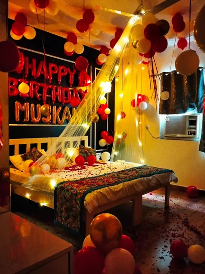 A slightly different view of the 'Muskan' birthday setup, showing how the fairy light canopy creates a warm and inviting glow over the entire bed.