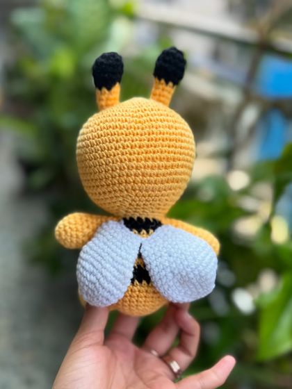 A view of the back of our bumblebee toy, showing its little white wings and classic striped body.