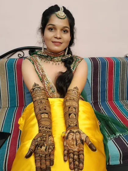 Another beautiful example of our portrait work, showing the bride and groom on the palms. The design extends up the arm with traditional wedding symbols.