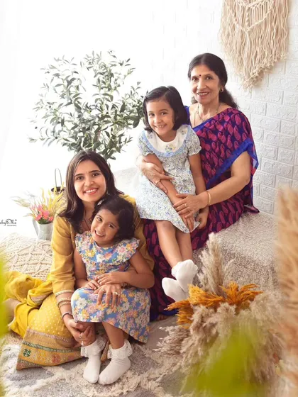 Three generations of beautiful ladies. A mother, grandmother, and two sweet girls all together make for an unforgettable family photo.