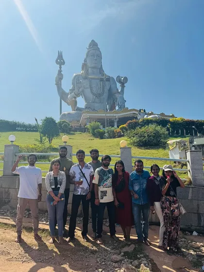 A group photo in front of the giant Shiva statue at Murudeshwar, an iconic landmark we visit on our coastal Karnataka tours.