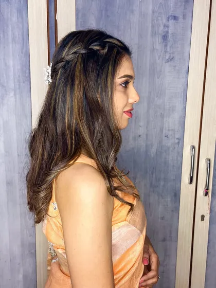A clean and natural makeup look for my client. The side profile shows the simple braided hairstyle and the soft, glowing skin.