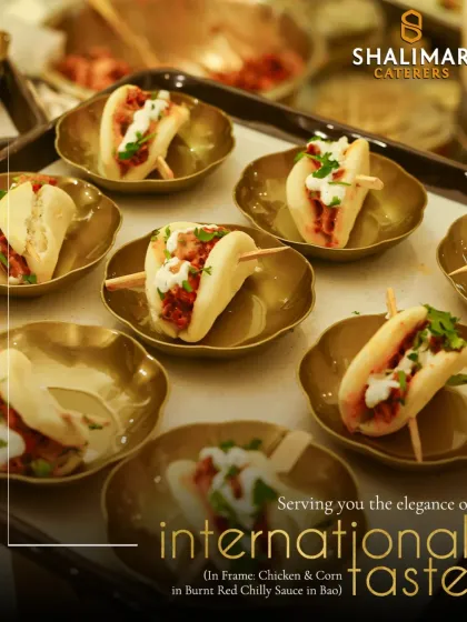 Serving you the elegance of international taste. These Chicken & Corn Baos with Burnt Red Chilly Sauce are served in beautiful brass-finished bowls, reflecting our expertise in global cuisine.