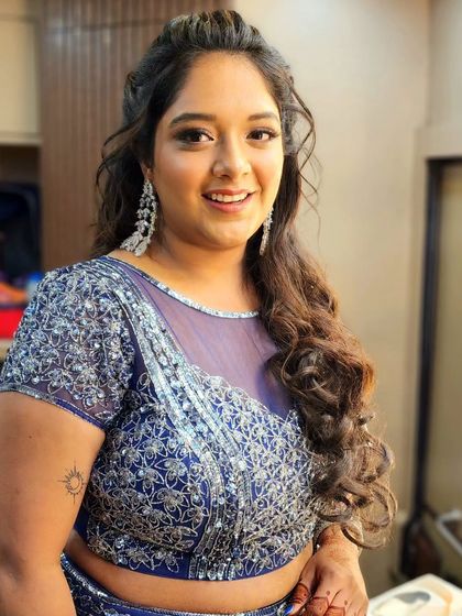 A subtle dewy glow for this engagement look. The makeup is fresh and minimal, letting the bride's natural beauty and stunning lehenga be the focus.