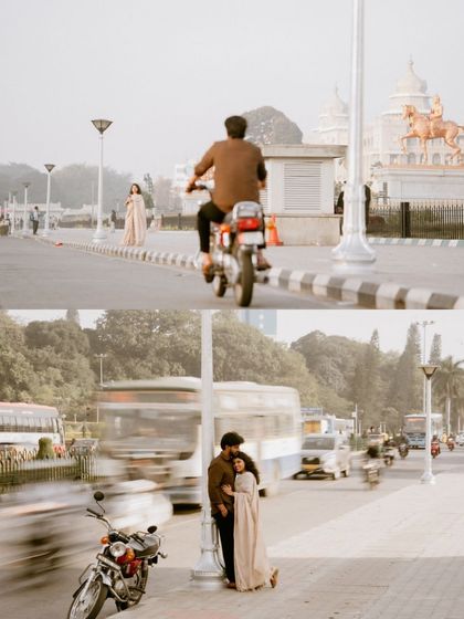 A dynamic shot using motion blur to capture the hustle of the city, with the couple as a calm, still point in the center of it all.