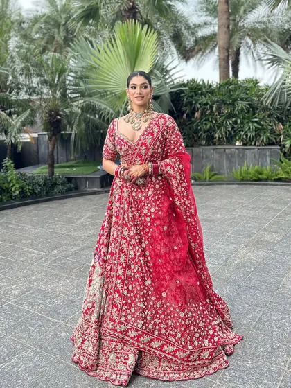 A full-length shot showcasing the grandeur of a traditional bridal look. The makeup was designed to be elegant and timeless, ensuring the bride looked and felt like royalty from every angle.