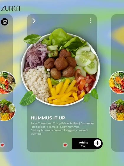A preview of our Hummus It Up bowl. It features crispy falafel, creamy hummus, and fresh veggies over a bed of Zatar cous-cous for a complete Mediterranean-inspired meal.