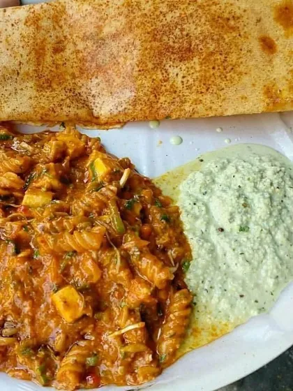 My fusion pasta dosa, combining Italian and South Indian flavors, served with traditional coconut chutney.