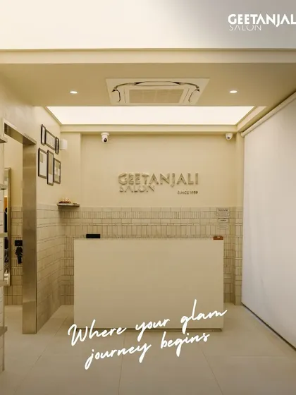 The glam journey begins here. The reception area of our Vasant Kunj salon is designed with clean lines and warm lighting to make you feel welcome and relaxed.