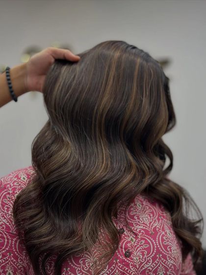 A close-up of the dimension in her new brown hair color. You can see the different tones working together.