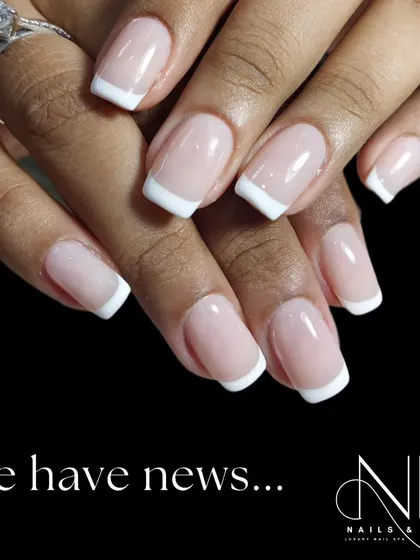 The classic French manicure remains a top request for its clean and timeless elegance. We ensure a perfect, crisp white tip and a flawless glossy finish on these natural-looking square nails.