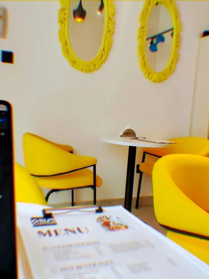 Welcome to our happy place in Sector 132. We designed our cafe with these bright, comfy chairs and cozy corners so you have the perfect spot to work, chat with friends, or just enjoy your meal.