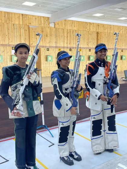 Three of our promising young athletes with their rifles at the Indian team selection trials, ready to compete at the highest level.