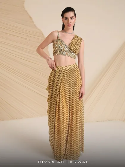 Our Verity co-ord set features a printed and hand-embroidered asymmetrical blouse with a drape-style skirt that’s made for twirling.