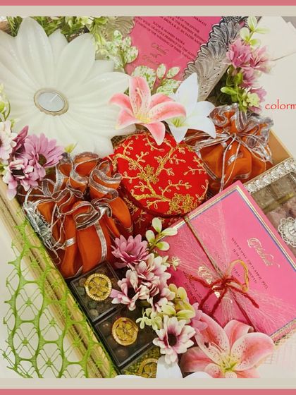 Our "Beginning of Forever" wedding invitation hamper, overflowing with flowers and gifts, designed to make an unforgettable first impression.