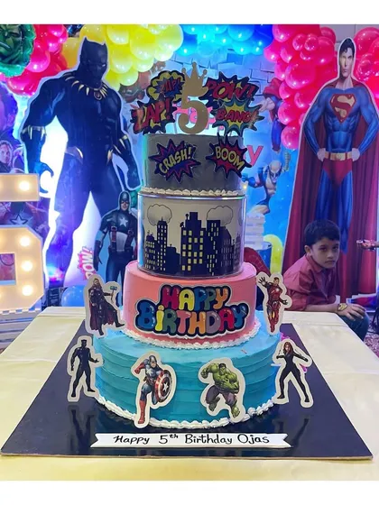 The completed 4-tier Avengers cake, ready for the party. This whipping cream cake is a great example of how we can create complex themes without using fondant.