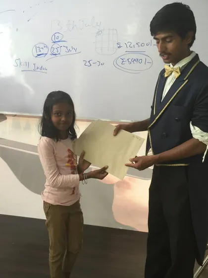 One of my favorite moments. This young magician has just completed the beginner magic class and is receiving her magician-in-training certificate. It's a proud moment for both of us.