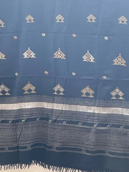 Another example of a hand-embroidered woollen shawl, perfect for the winter season. The intricate patterns are stitched with care by my artisans.