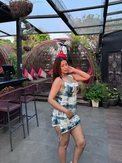 A tie-dye print bodycon mini dress, a trendy and fun look for a day out.