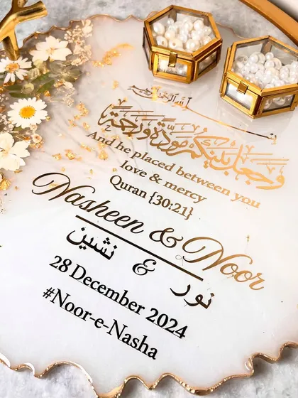 A detailed shot of the personalization, including the couple's names, wedding date, and hashtag.