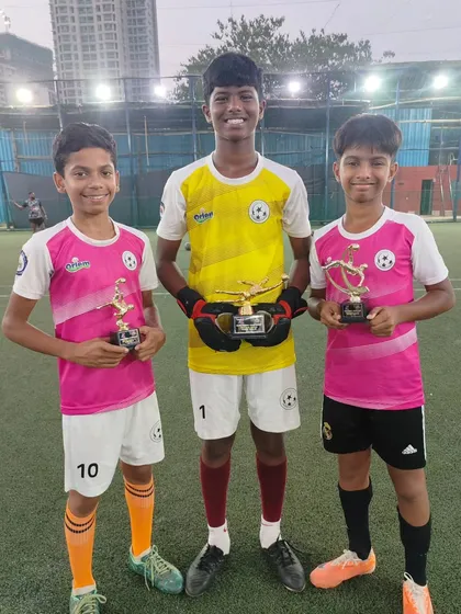 Our trio of award winners. Deon (Best Goalkeeper), Wilfred (Best Playmaker), and Kayden (Best Emerging Player) showcasing their individual trophies.