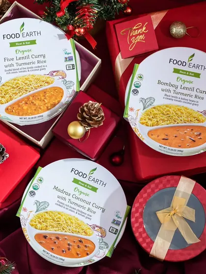 This shot styles ready-to-eat meals as a thoughtful holiday gift. By placing the products in festive gift boxes with Christmas ornaments, I transformed them into a unique and convenient present idea for a seasonal campaign.