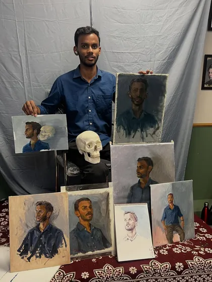 A wonderful moment at the end of the session, with the model Satyam surrounded by the various portraits and studies created by the artists present. It’s a great showcase of different artistic interpretations from a single sitting.