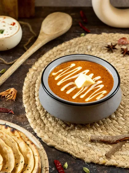 This shot captures the heart of North Indian cuisine. I used dark, moody lighting to emphasize the rich texture of the curry and the creamy swirl, making this classic dish feel both comforting and luxurious for a restaurant's menu.