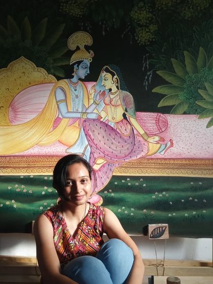 Here I am with the completed 4x4 ft Pichwai painting of Radha and Krishna. It's always a special feeling to sit with a finished piece that carries so much tradition and story.