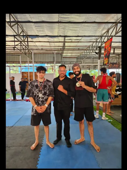 Our coach with two of our victorious athletes at the RAW Championship 2.0, showcasing the bond between mentor and student.