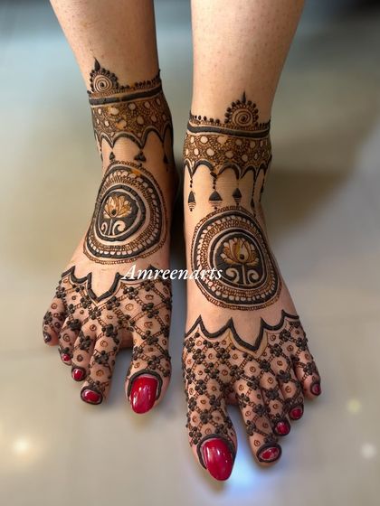 A modern and bold foot design featuring a central lotus mandala, perfect for the contemporary bride.