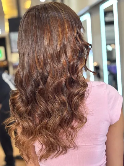 A beautiful shot of the hazelnut brown hair from the back, showing the seamless blend of tones. This is a perfect example of a professional, high quality hair color.
