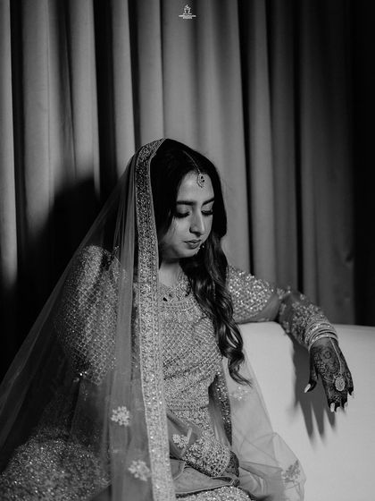 A duplicate of ID 339, this black and white portrait captures a Muslim bride's thoughtful and elegant pose.