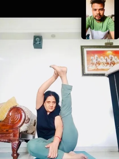 This is a glimpse into my online advanced yoga class. I give direct, real-time feedback to each student, correcting their alignment in complex poses like this seated leg-behind-head variation. It's personal training, even in a group setting.