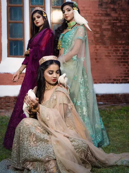 This shot includes a third bridesmaid in a deep purple lehenga, showing how you can mix and match colors from my collection for your bridal party.
