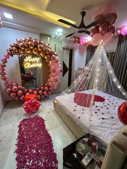 The full romantic room decoration package. This comprehensive setup ensures every corner of the room is part of the celebration, from the balloon ring to the decorated bed.