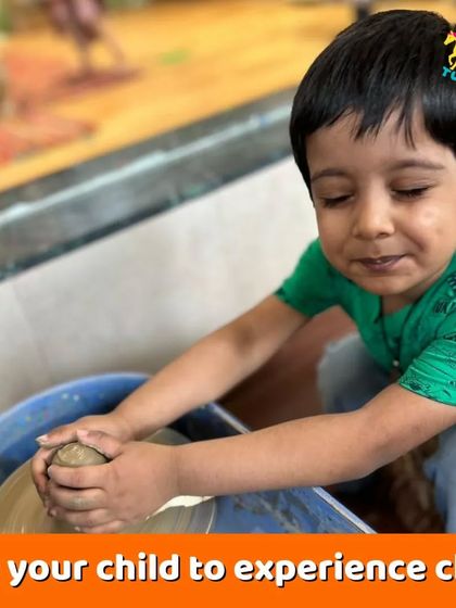 This little one is completely absorbed in the sensory experience of working with clay. It's a fantastic way for toddlers to explore textures and develop their motor skills.