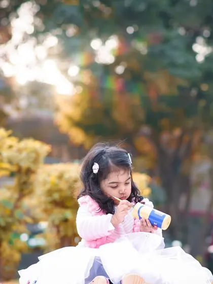 I capture the little moments of concentration and play during our themed outdoor shoots.