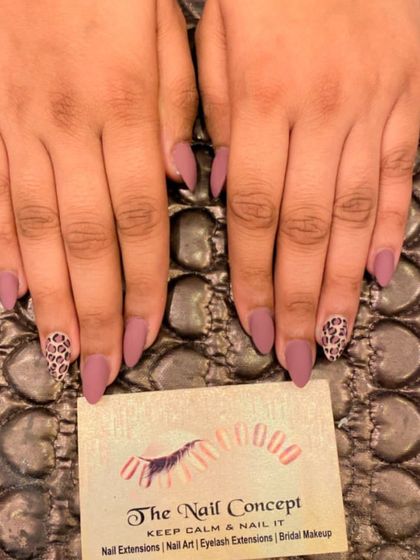 A chic and understated animal print design. This set features matte mauve stiletto nails with accent nails showing a classic leopard print.