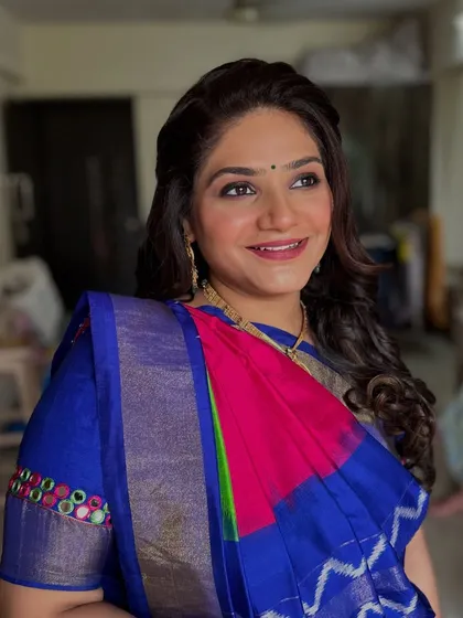 A happy, candid moment. The makeup looks fresh and beautiful in natural light.