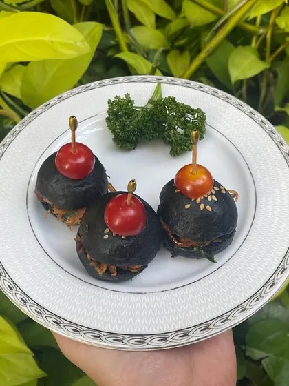 Charcoal Pulled Mushroom Sliders. These striking black buns are filled with savory pulled mushrooms, offering food for the soul.