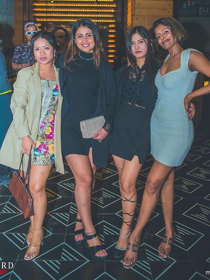 A group of stylishly dressed ladies at the Christmas event.