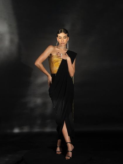 A dynamic pose from the Nikhil Thampi shoot, showcasing the movement and structure of the gown.