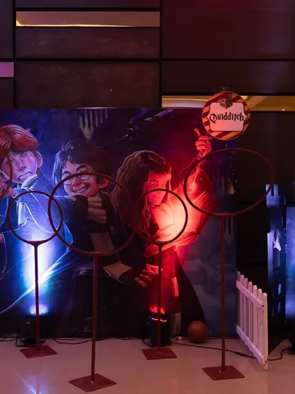 A Quidditch game setup with hoops and a themed backdrop, allowing guests to feel like they are part of the famous wizarding sport.