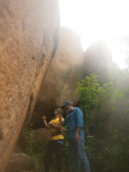 Two climbers discussing beta before a climb. Sharing knowledge and encouraging each other is a core part of our community's spirit.