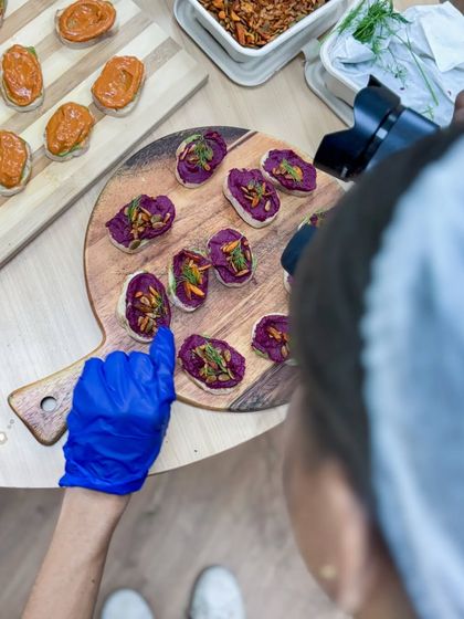 Our chefs pay attention to every detail, from the flavor combinations to the final presentation. Here, we're capturing our beautiful beetroot hummus tartines.