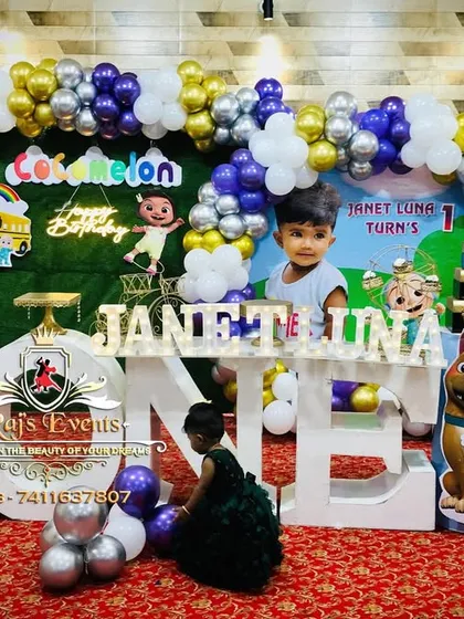 We bring popular cartoons to life with our fully themed party setups. This Cocomelon birthday party features a complete stage with character cutouts, a vibrant balloon arch, and large light-up letters spelling 'ONE' for a picture-perfect first birthday celebration.